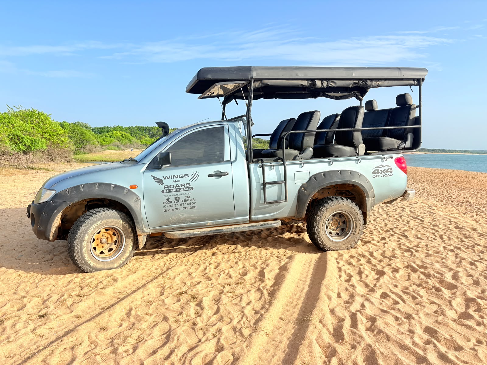 Expedition ready 4x4 safari vehicles at Okanda entrance to Kumana